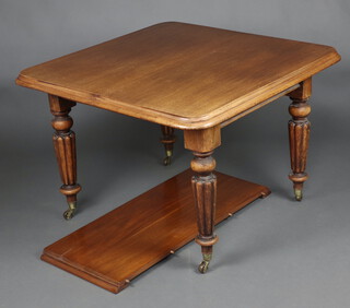 A Victorian mahogany extending dining table raised on turned and reeded supports with 1 extra leaf 72cm h x 102cm w x 102cm l x 145cm l when extended, complete with winder  