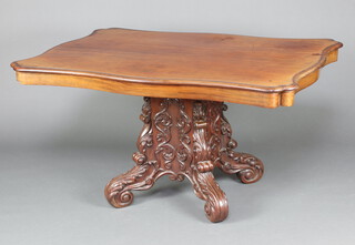 A 19th Century Dutch walnut centre table of serpentine outline, raised on a shaped carved pedestal base 140cm w x 100cm d 