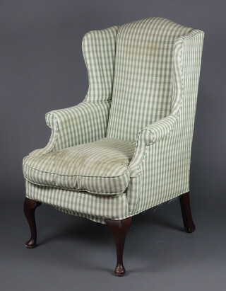 A Georgian style winged armchair upholstered in green and white chequered material, raised on cabriole supports 115cm h x 74cm w x 70cm d (seat 40cm x 40cm) 