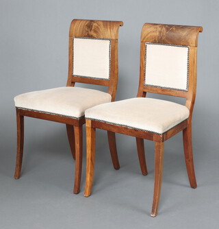 A pair of Dutch mahogany bar back dining chairs, the seats and backs upholstered in cream material, raised on sabre supports 86cm h x 48cm w x 41cm d 