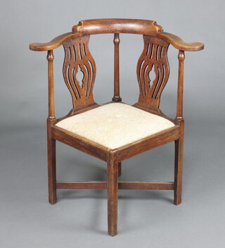 An 18th Century oak slat back corner chair with upholstered drop in seat, raised on square supports with X framed stretcher 81cm h x 77cm w x 61cm d 