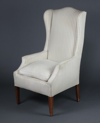 A Georgian style winged armchair upholstered in green and white material 115cm h x 64cm w x 60cm d (seat 32cm x 30cm) 