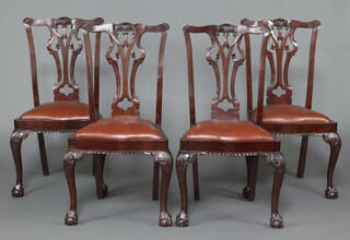 A set of 4 Edwardian carved mahogany Chippendale style dining chairs with pierced vase shaped slat backs and seats of serpentine outline, raised on cabriole supports 104cm h x 52cm w x 45cm d 