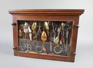 A good collection of 19th Century and later fishing lures contained in a mahogany display case 34cm h x 48cm w x 8cm d 