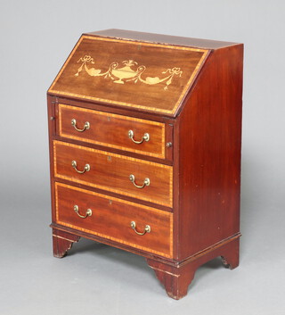 An Edwardian inlaid mahogany bureau, the cross banded fall front revealing a well fitted interior above 3 long drawers, raised on bracket feet 95cm h x 69cm w x 43cm d 