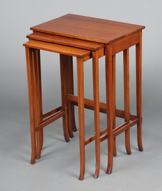 An Edwardian nest of 3 rectangular inlaid mahogany coffee tables, raised on square tapered supports 69cm h x 49cm w x 33cm w  