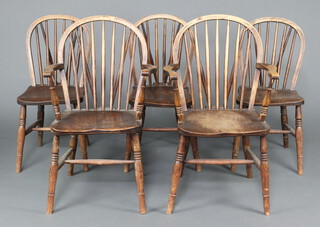 A matched set of 5 19th/20th Century elm stick and hoop back Windsor chairs raised on turned supports with H framed stretchers comprising 2 carvers impressed H S 94cm h x 59cm w x 38cm d and 3 standard chairs 85cm h x 35cm w x 45cm d 