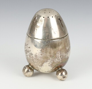 A Victorian silver ovoid shaped shaker on ball feet, London 1876, 81 grams, 8cm 