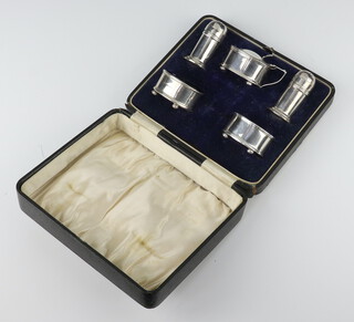 A silver 5 piece condiment set with blue glass liners Birmingham 1945, 111 grams, boxed