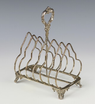 A Victorian silver 7 bar toast rack raised on scrolled feet London 1884, 362 grams, 16cm 