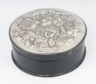 A circular trinket box with repousse silver Reynolds angels lid, London 1989, 16.5cm 