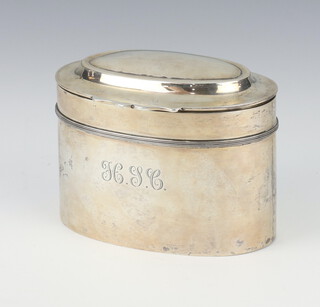 An oval silver tea caddy with engraved monogram London 1919, 149 grams, 9.5cm 