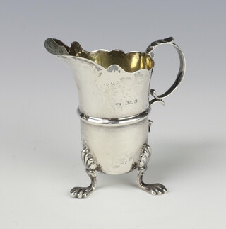 An Edwardian silver cream jug with S scroll handle on paw feet Birmingham 1906, 71 grams, 9cm 