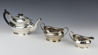 A silver 3 piece tea set comprising teapot, sugar bowl and milk jug Birmingham 1919, 854 grams gross including ebony mounts 