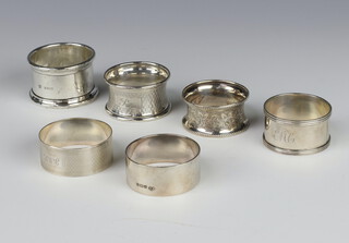 A silver napkin ring London 1924 and 5 others, 108 grams 