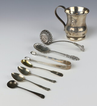 A silver baluster mug with simple handle, Birmingham 1916 (dented), 4 silver spoons and a pair of nips 261 grams together with 2 plated spoons 