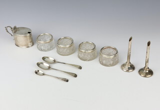 A silver mustard with blue glass liner, 4 silver mounted glass bowls, 2 spill vases, a mustard spoon and 2 teaspoons, weighable silver 133 grams 