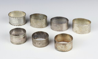 A silver engine turned napkin ring Birmingham 1928 and 4 others, 2 plated ditto, weighable silver 124 grams 