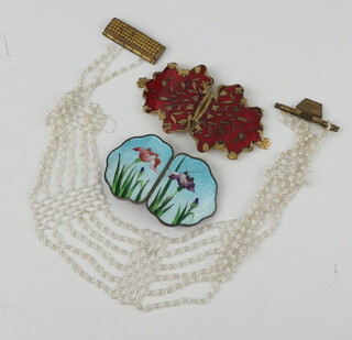 A white metal ginbari enamelled buckle decorated with flowers, another buckle and a beadwork necklace 