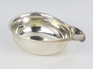 A George III silver pap boat of plain form with engraved armorial London 1815, 55 grams 