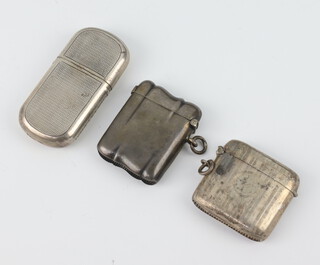 A silver vesta Birmingham 1922, 1 other and a silver engine turned cigarette lighter 