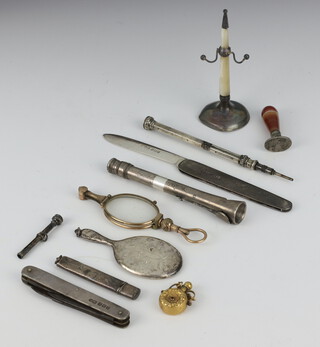 A silver miniature hand mirror 7cm, 2 silver mounted pen knives, a pencil holder, propelling pencil and minor items 