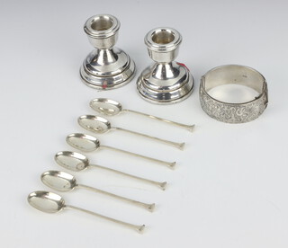 A set of 6 silver seal top coffee spoons Sheffield 1916, pair of dwarf candlesticks 7cm and a bangle 