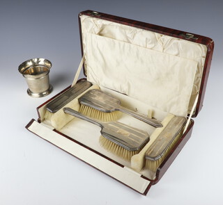 An Art Deco silver dressing table set comprising 2 hair brushes and 2 clothes brushes Birmingham 1932, cased, together with a silver tapered vase 10cm 