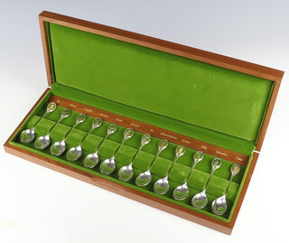 A set of 12 silver Royal Horticultural Society spoons, Sheffield 1973, 329 grams, cased