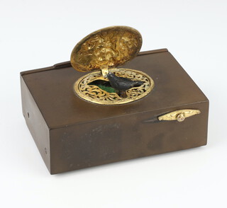 A Swiss singing bird automaton music box in the manor of Reuge designed with a singing bird with moving wings beneath a gilt oval repousse cover with a scene of revellers and birds, contained in a burr walnut case 3.5cm x 10cm x 6.5cm, the reverse with an opening flap, together with clock key

LOT AMENDMENT - The bird shaped originally catalogued with this lot has been added to lot 227 this lot now comes with a simple clock key