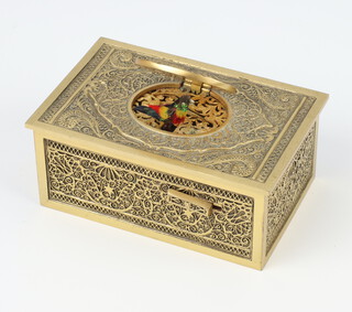 An early 20th Century gilt metal musical automaton bird box in the manor of Karl Griesbaum, the box profusely decorated with scrolls and filigree, the multi coloured bird with moving wings and beak 4cm x 10.5cm x 6.5cm with bird shaped key 
 
LOT AMENDMENT - The bird shaped key originally catalogued with Lot 226 has been added to this lot and the clock key that was with to this lot has been added to lot 226  