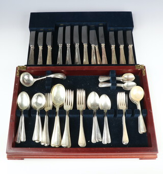 A canteen of silver rat tail cutlery comprising 12 silver handled dessert knives, 12 silver handled dinner knives, 12 silver dessert forks, 12 silver dinner forks, 12 silver tea spoons, 11 silver dessert spoons, 11 silver soup spoons, 4 silver tablespoons and 2 ladles, Sheffield 1996, 3566 grams (excluding knives) 