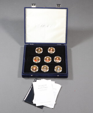 Twenty gilt commemorative medallions 