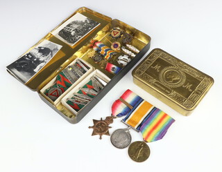 A World War One trio of medals 1914 Star and 1914 bar, War Medal and Victory Medal to 68.S Driver E.R.Heath M.T.R.N.Div. with 1914 bar, together with miniatures and 1914 Christmas tin with written inscription Dr G R Heath, together with a photograph of the recipient with his bus with later silver driver medallions with bars 1928 to 1941 