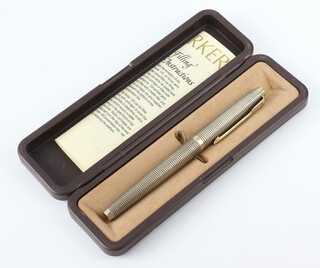 A Parker silver gilt fountain pen with 14k nib, boxed