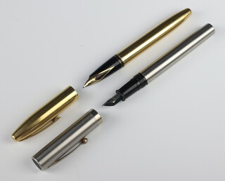 A vintage steel cased Waterman fountain pen, a gilt cased Cross fountain pen with 18ct nib 