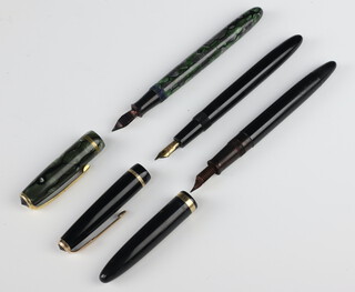 A Parker Slimfold black fountain pen with 14ct nib, ditto Sheaffer fountain pen (lacking clip), a Burnham no.65 green marbled fountain pen no.56 