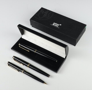 A Montblanc 320 black fountain pen, a ditto no.22 fountain pen and a ditto Classic propelling pencil boxed 