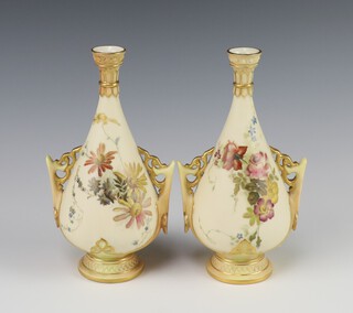 A pair of Victorian Royal Worcester blush ivory and rose decorated twin handled vases, the bases with purple Royal Worcester mark, 3 dots and 982, 17cm 