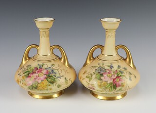 A pair of Victorian Royal Worcester blush ivory twin handled vases of squat form, the bases with purple Royal Worcester mark, 21 dots and 1747 15cm h