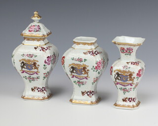 A pair of Sampson octagonal waisted vases (1 lacking its cover, the other with stuck knop) 18cm with armorial, together with an ensuite octagonal baluster vase 12cm 