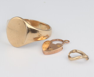 A 9ct yellow gold signet ring size R, ditto padlock, 7 grams