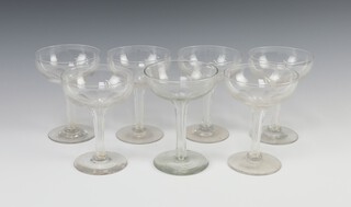 A near set of 7 champagne coupes with hollow stems 