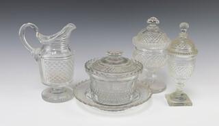 A 19th Century cut glass ewer raised on a circular base 18cm h, a ditto circular jar and cover 18cm, urn and cover on a square base 19cm and a bowl and stand 14cm 