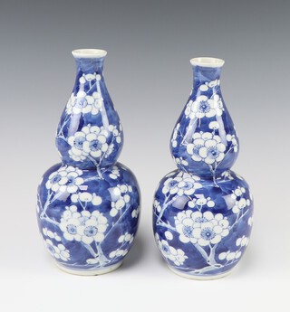 A pair of Chinese prunus pattern double gourd shaped vases, bases with 4 character mark 20cm 