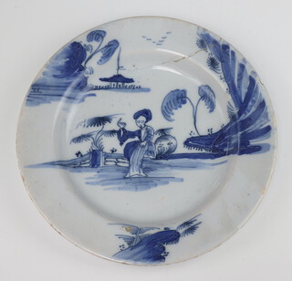 An 18th Century Delft blue and white plate decorated with a seated lady with pavilion in the background 23.5cm 