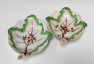 A pair of 18th Century Chelsea dishes decorated with nuts and berries 26cm, one with gold anchor mark and one has a red anchor mark  