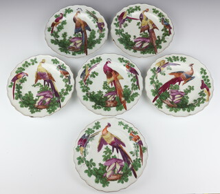 Six Chelsea plates circa 1758-70 decorated exotic birds amongst foliage the central bird perched on rocks, all with brown anchor mark, 20.5cm diameter 