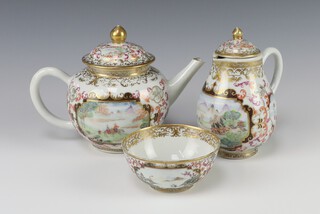 An 18th Century Chinese porcelain teapot of bulbous form and panel decoration of landscapes and birds 8cm (chip to spout), together with a sparrow beak cream jug, matching tea bowl and associated lid 