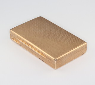 A 9ct yellow gold engine turned rectangular pill box with engine turned decoration, London 1917, 69.4 grams, by the Goldsmiths and Silversmiths Company 75mm x 45mm x 14mm  